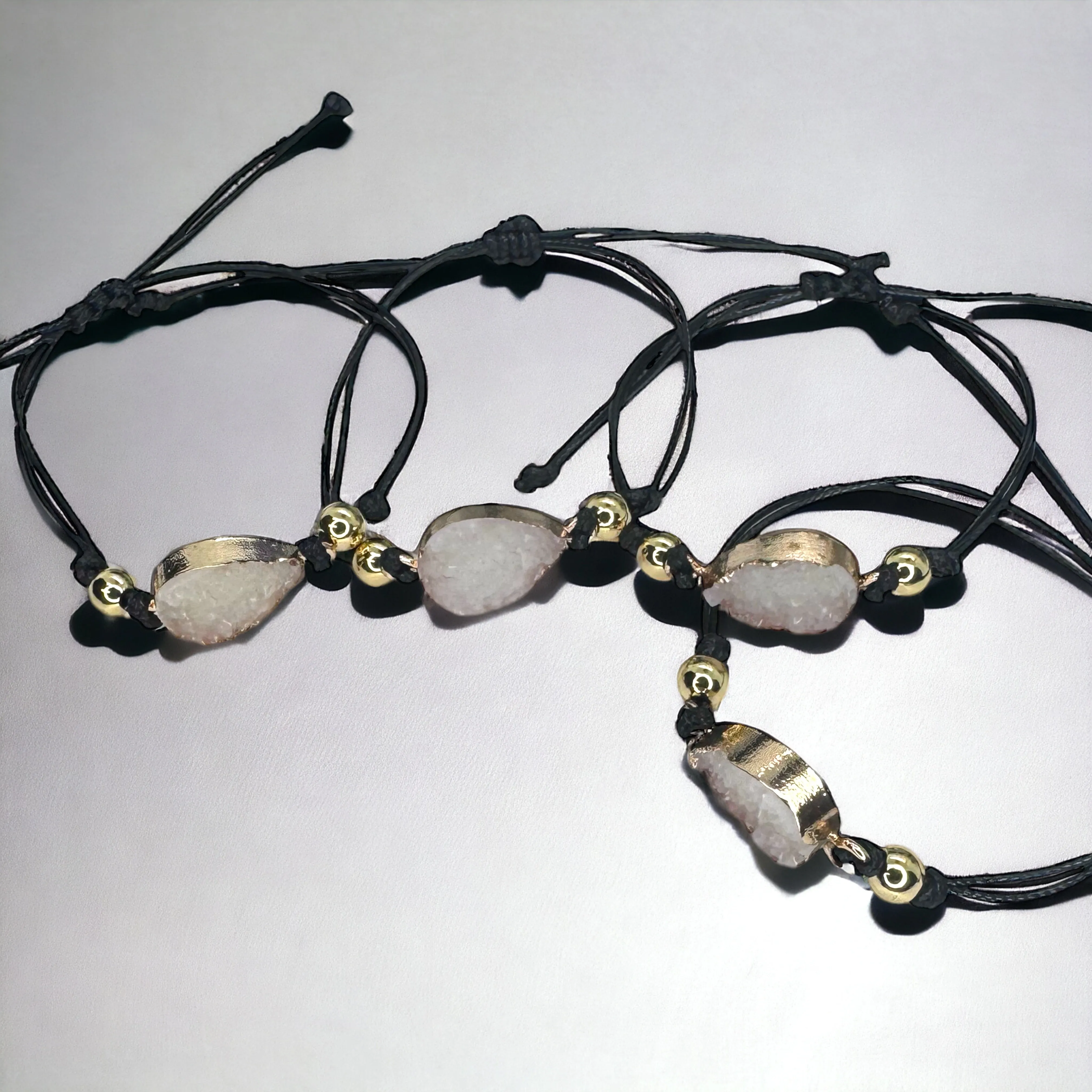 Black Leather Bracelet with Gold and White Charm